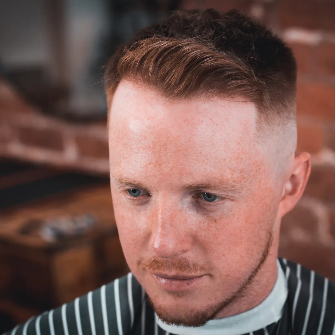 A longer scissor-led haircut with length kept on top, finished at the chair.