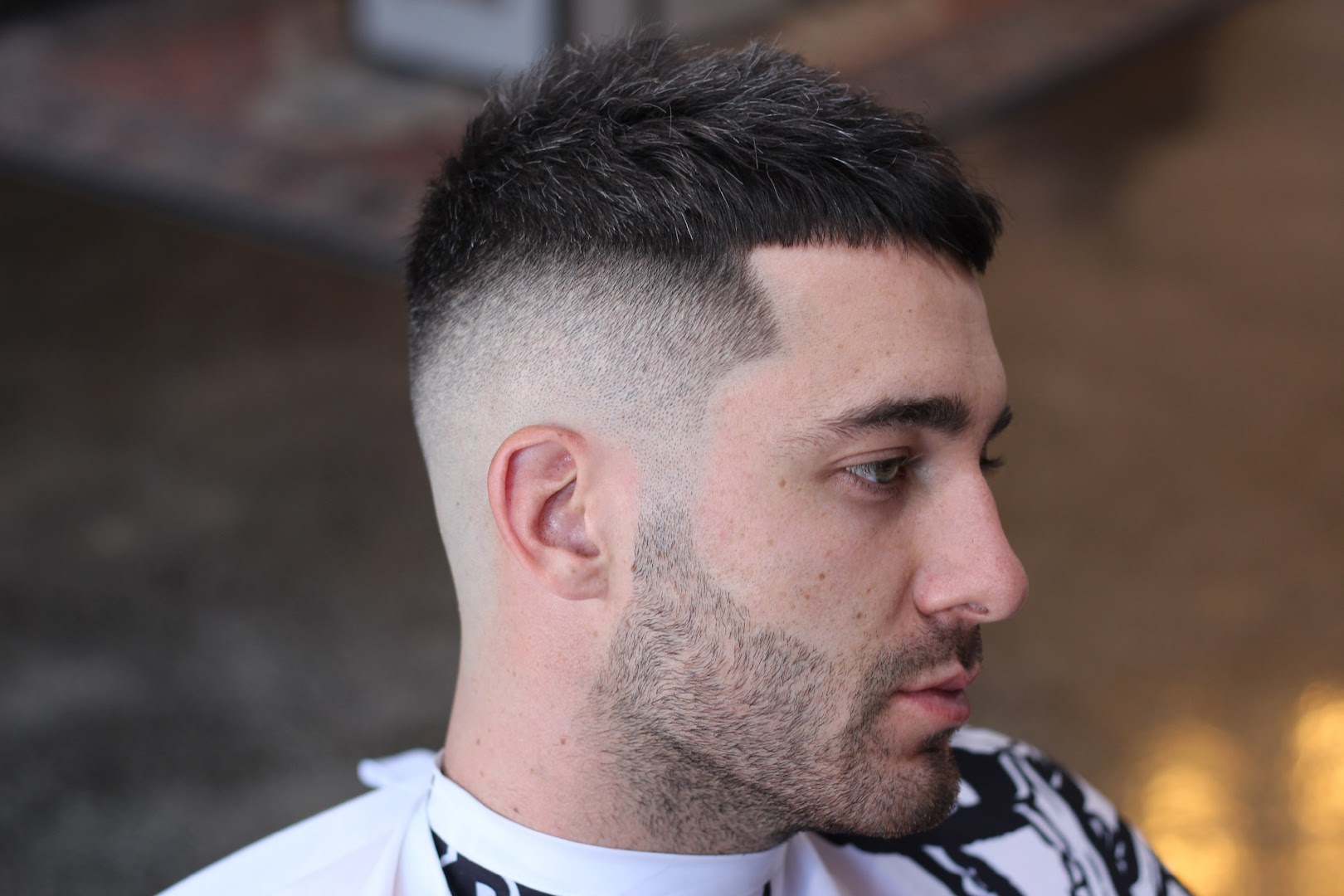 A finished skin fade and sharp hairline, photographed at Amunra Barbershop